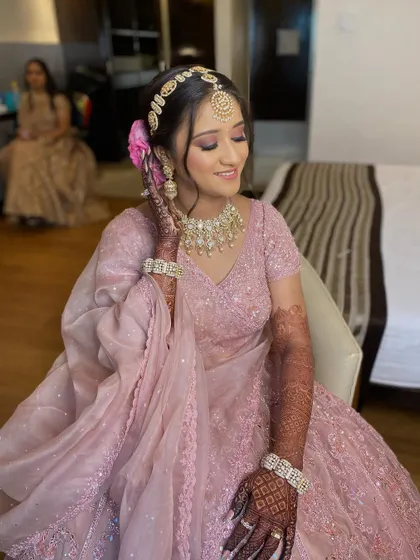 My bride Pearl, looking pretty in pink for her wedding day. The makeup is soft and romantic, with pink tones on the eyes and lips to match her beautiful lehenga.