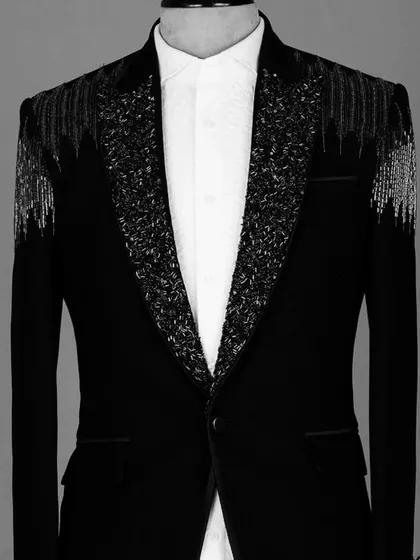 A designer blazer with sparkling tassels on the shoulders. This is a high-fashion piece for someone who wants to make a bold statement at a party.