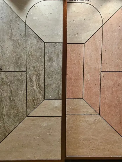 A display of 'Travertine' finish Ittimi panels. The clever graphic design creates a 3D illusion of depth, adding a unique artistic touch.