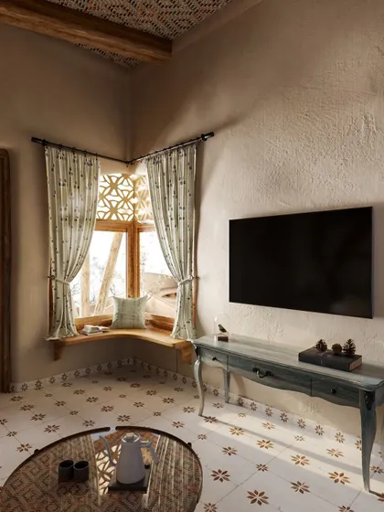 A close-up of the corner window nook, a perfect spot to feel connected to the outdoors while being sheltered in comfort. The elegant console table adds a touch of classic style to the rustic space.