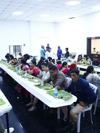 A clean and organized dining hall setup for a large number of guests, ready for our banana leaf service.