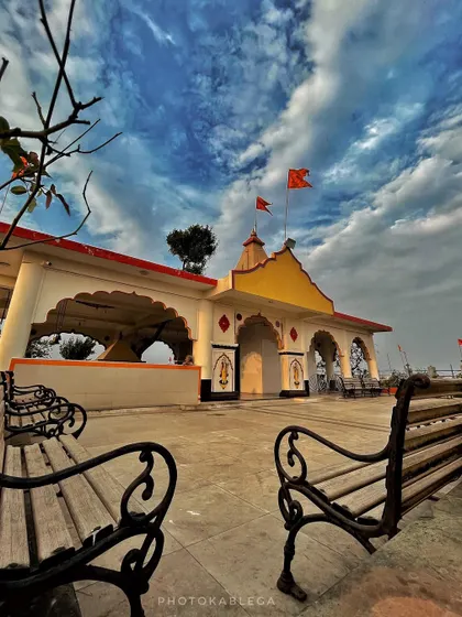 A side view of the temple on Gilbert Hill, with benches for devotees to sit and enjoy the view.
