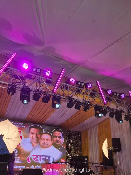 A close-up of the lighting truss in action, casting a purple glow over the stage. This type of dynamic lighting is perfect for performances, award ceremonies, or any event where you want to create a memorable visual impact.