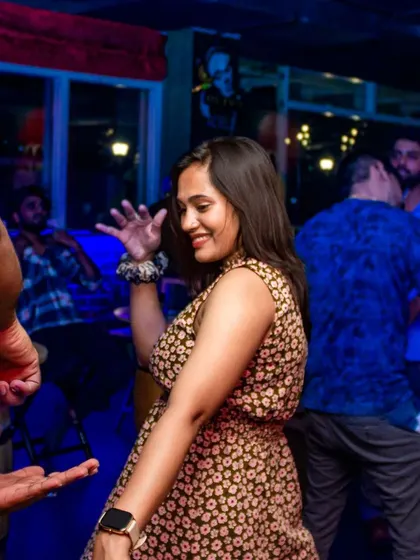 A guest dancing with a smile, enjoying the music and the crowd. The atmosphere is always welcoming and energetic.