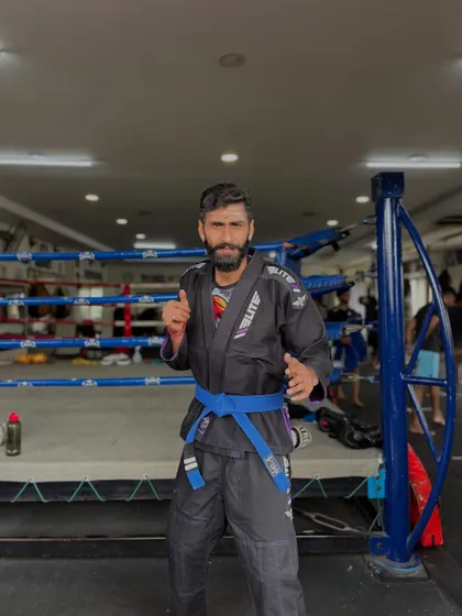 Standing in my BJJ Gi. Grappling is a key part of my fight philosophy and a critical skill for all my fighters.