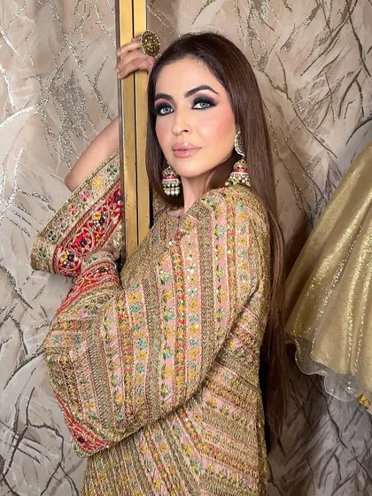 This is a traditional Arabic-inspired makeup look, featuring a deep, black smokey eye. The intensity is created with rich kohl and blended shadows, perfect for a festive or celebratory shoot.