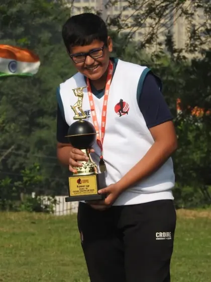 Another happy player with his trophy. The joy of competing and being recognized is what youth cricket is all about.