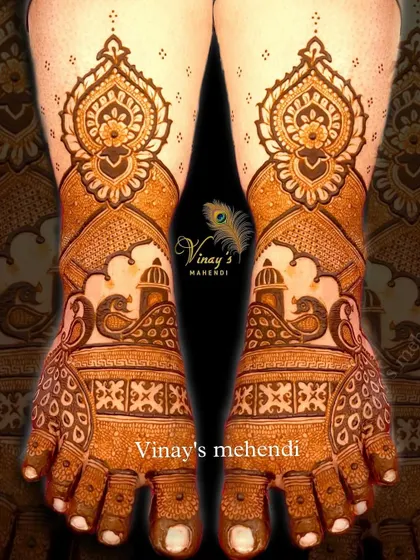 Bridal feet mehndi with a mix of traditional motifs, including palace architecture, peacocks, and intricate floral patterns for a rich and detailed look.