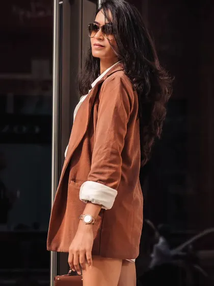 A side profile that shows the details of the outfit. Every element is chosen to project confidence and style.