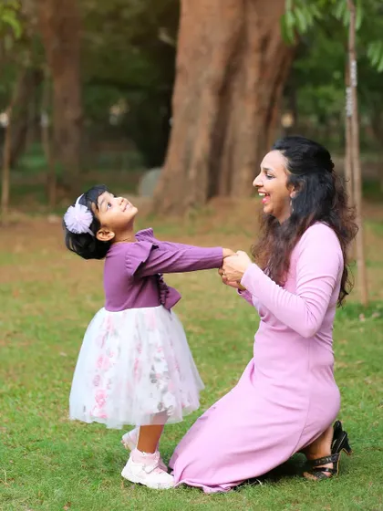 A playful moment between mother and daughter during their outdoor family session. My goal is to make the session feel like playtime to get these genuine smiles.