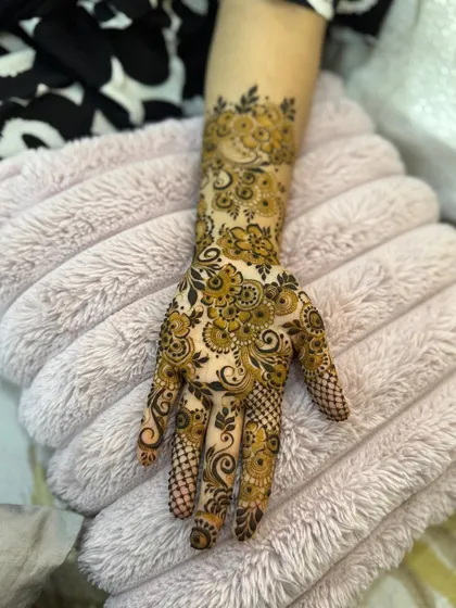 Another angle of the dense paisley and floral henna, highlighting the shading and detail.