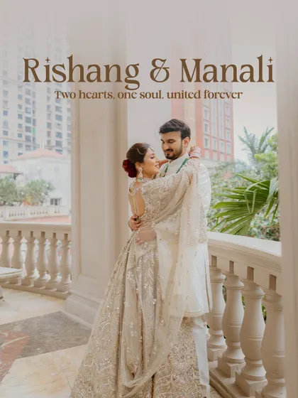 A beautiful and elegant portrait of the couple on a balcony overlooking the city. Their coordinated white outfits exude sophistication and grace.