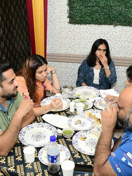 A candid shot of guests enjoying their meal and conversation.