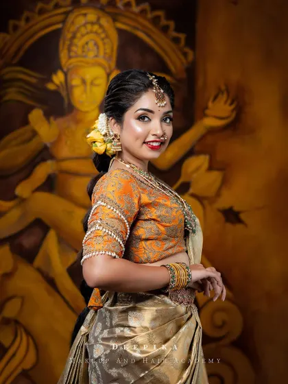 This view highlights the traditional braid adorned with fresh flowers, an essential part of the South Indian bridal look that I adore.