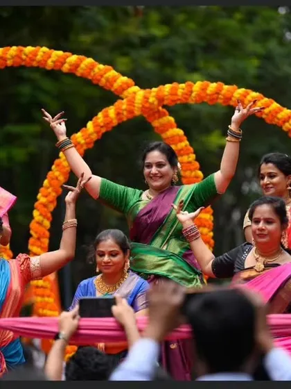 A group of our dancers in a joyful pose during the Ganesha procession. We love bringing the community together through the celebration of cultural traditions.