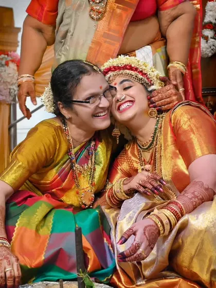 The pure joy and laughter between two family members during a celebration. These candid moments are what we live for, capturing the real emotions that make each family event unique.