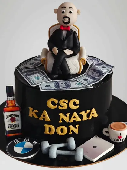 A fun "Naya Don" cake for a celebration of success. This cake features a fondant figure, edible money, and icons of luxury like a BMW logo and Jim Beam bottle.