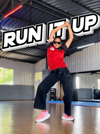 A powerful pose from our "Run It Up" choreography. This shot shows the dynamic shapes and strong lines we teach in our hip-hop dance classes.