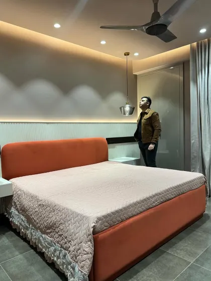 Another shot of the orange bed, showing how the color adds a warm and energetic feel to the space.