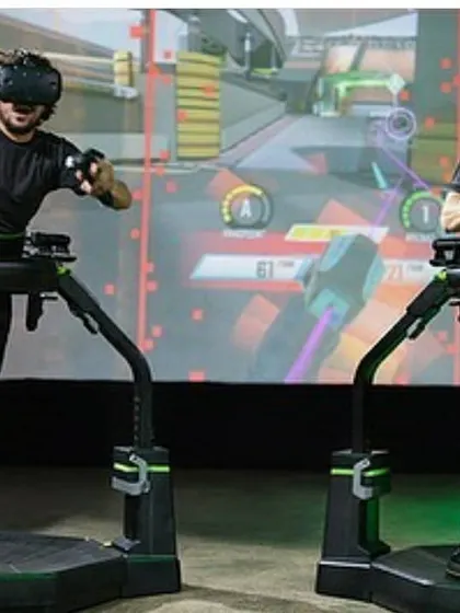 A clear shot of the Virtuix Omni installation, showcasing the safety harness and ring that allows users to move freely and safely within the virtual environment.