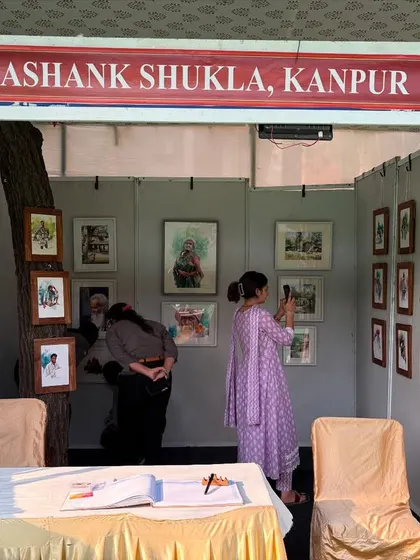 Visitors viewing my watercolor and sketch artworks at my stall during the Jaipur Kala Mela.