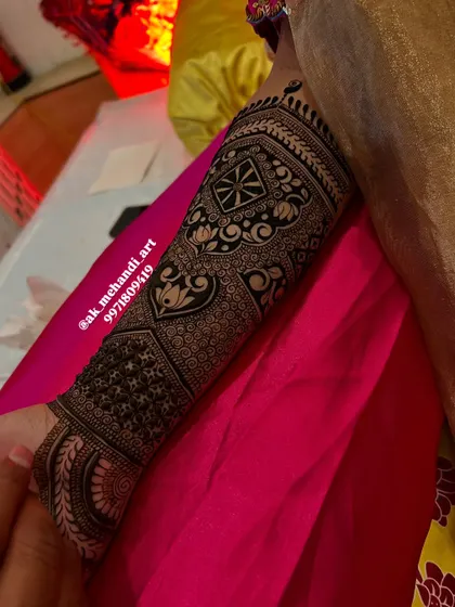 Another section of the same bridal arm, showcasing a different set of patterns and motifs.
