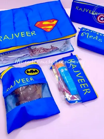 Making memories, one tiny adventure at a time! This personalized superhero-themed travel organizer set for kids includes pouches for clothes, medicine, and other essentials.