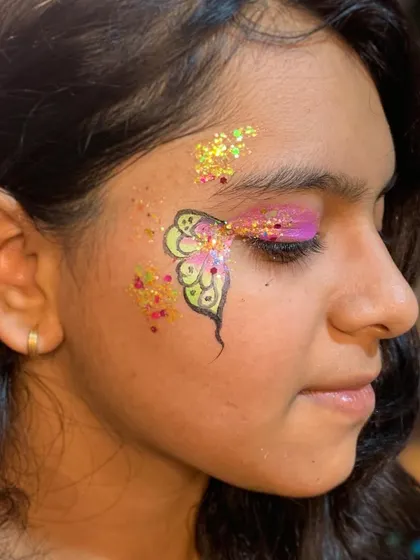 A close-up of the pink and yellow butterfly, showing the color blending.