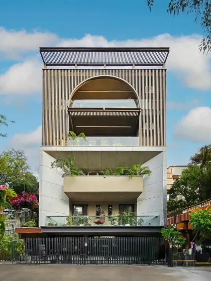 This project in Gurugram features a classical facade adorned with sophisticated grey and white tones alongside opulent gold aluminum louvers. This design redefines luxury and elevates the living space to new heights.