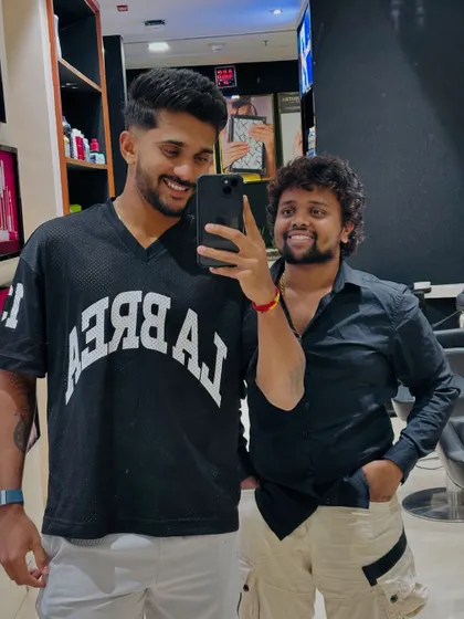A smiling selfie with Nitish Kumar Reddy, happy with his new style.
