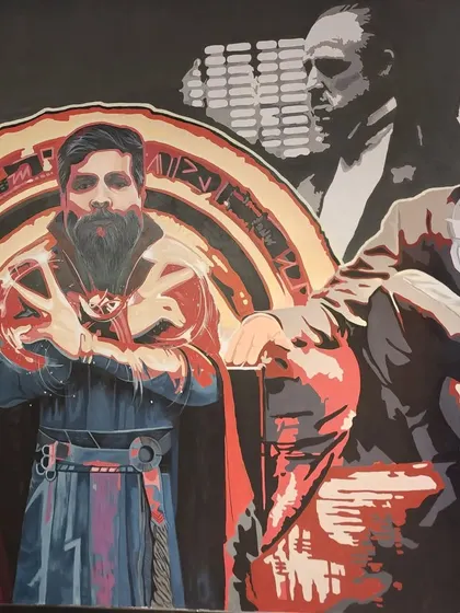 Another close-up from 'The Bosses' mural, showing the detailed portrait work.