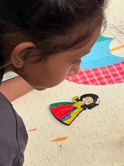 A close-up of a Snow White figurine being painted. We offer a variety of high-quality wooden shapes and characters to match any party theme.