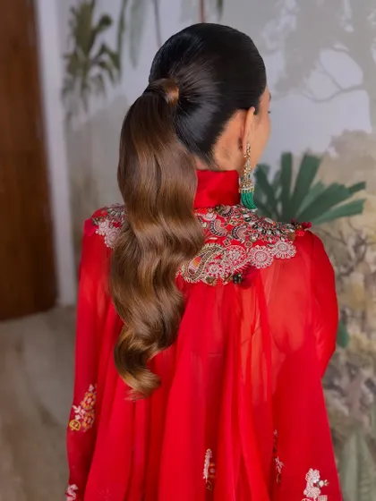 A back view of the sleek ponytail with beautiful, sculpted waves.