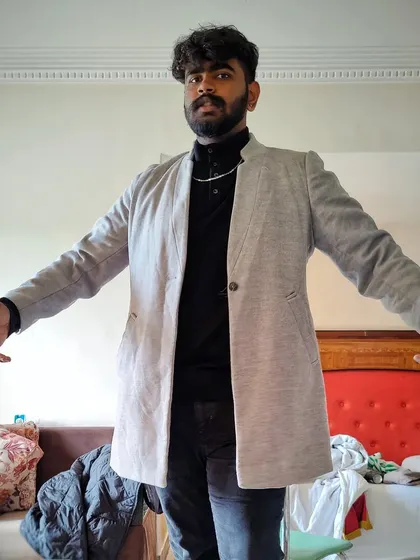 A photo showing off my signature grey jacket, my "uniform" for big shows.