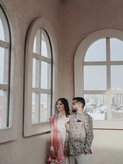 A more artistic take on the window portrait, with the couple looking out, as if towards their future together.