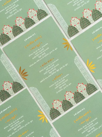 A modern take on a traditional design, this green card uses stylized tree motifs and elegant Gujarati script for a fresh and contemporary feel.