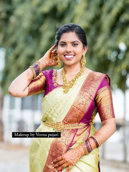 A beautiful smile from a happy pellikuturu (bride). Her natural joy is the best accessory.