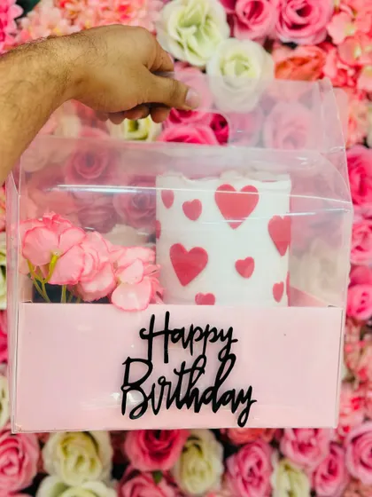 My special occasion hamper, which includes a half kg tall cake, a bunch of flowers, and a topper, all beautifully packaged. It's a complete gift solution.