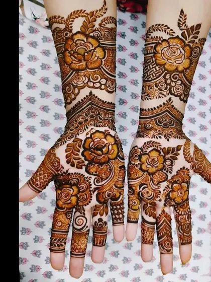 A beautiful floral design for the back of the hands, with a mix of bold flowers and delicate vines.