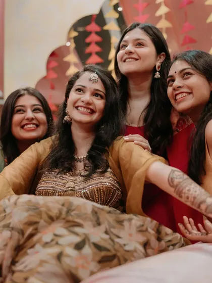 A beautiful candid of the bride and her friends looking up in joy.