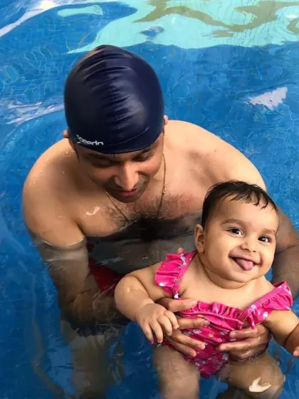 That happy, cheeky smile says it all. This is what a fun, pressure-free swim lesson looks like.