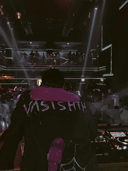 A shot from behind, showing my custom jacket and the view of the packed club. It's about the music, the energy, and the style.