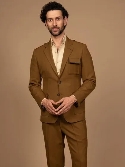 My mustard leather-detailed suit is designed to be travel-friendly. Crafted from 100% all-weather fabric, it's perfect for the modern man on the go.