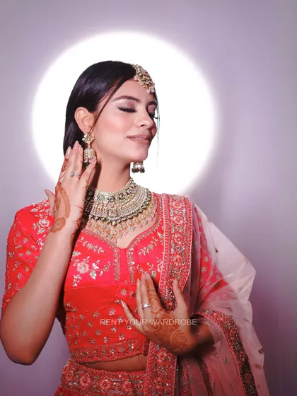 A close-up portrait in the pink lehenga, capturing a soft and romantic mood.