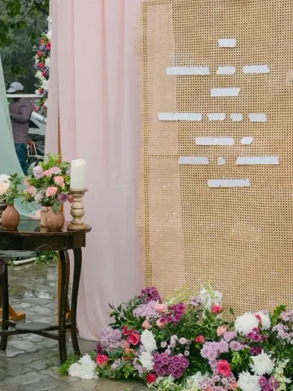 Even a rainy day can be beautiful. We used subtle pastel drapes, handmade pots, and peach florals to create an intimate and romantic atmosphere that glowed, even with the rain.