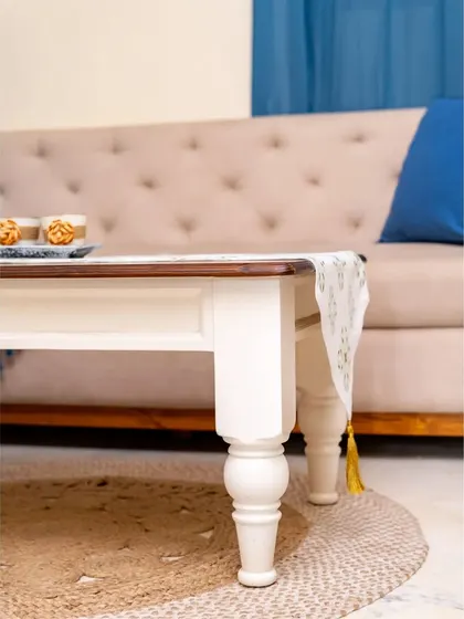 The apron of this coffee table is simple, allowing the turned legs to be the main design feature.