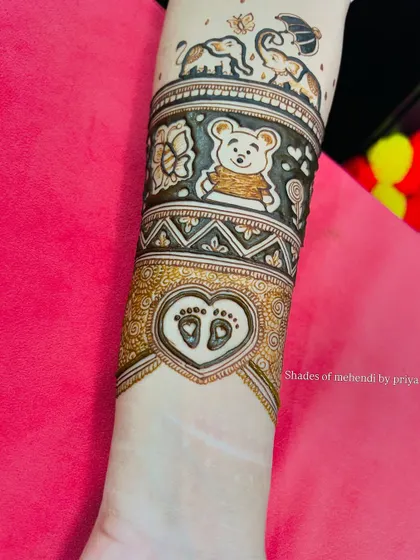 Another view of the detailed arm band for the baby shower mehendi.