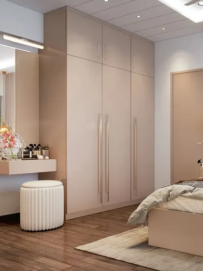 This bedroom has a built-in vanity nook next to the wardrobe. The floating design and minimalist stool keep the look clean and uncluttered.