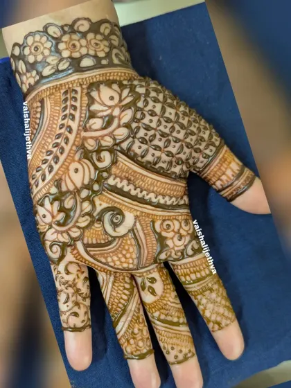 An intricate design with a mix of bird and floral motifs. The pattern is dense and detailed, perfect for someone who loves a full look.