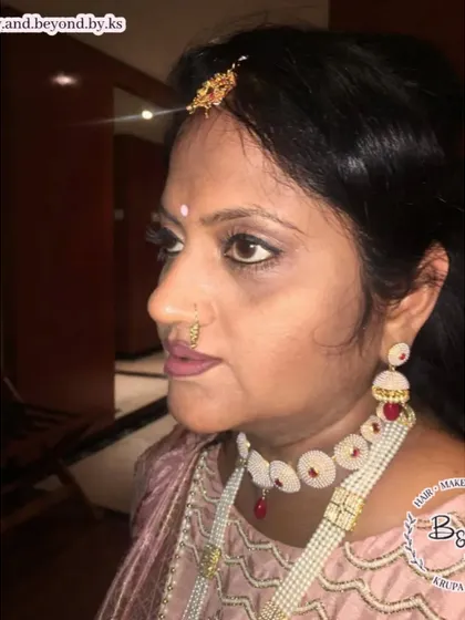 This soft glam look was created for another lovely aunt of the bride. I used mauve tones on the eyes and lips and a clean winged eyeliner to define her eyes, creating a subtle and sophisticated look for the wedding.